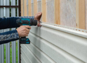 Installing residential siding with a drill for secure attachment